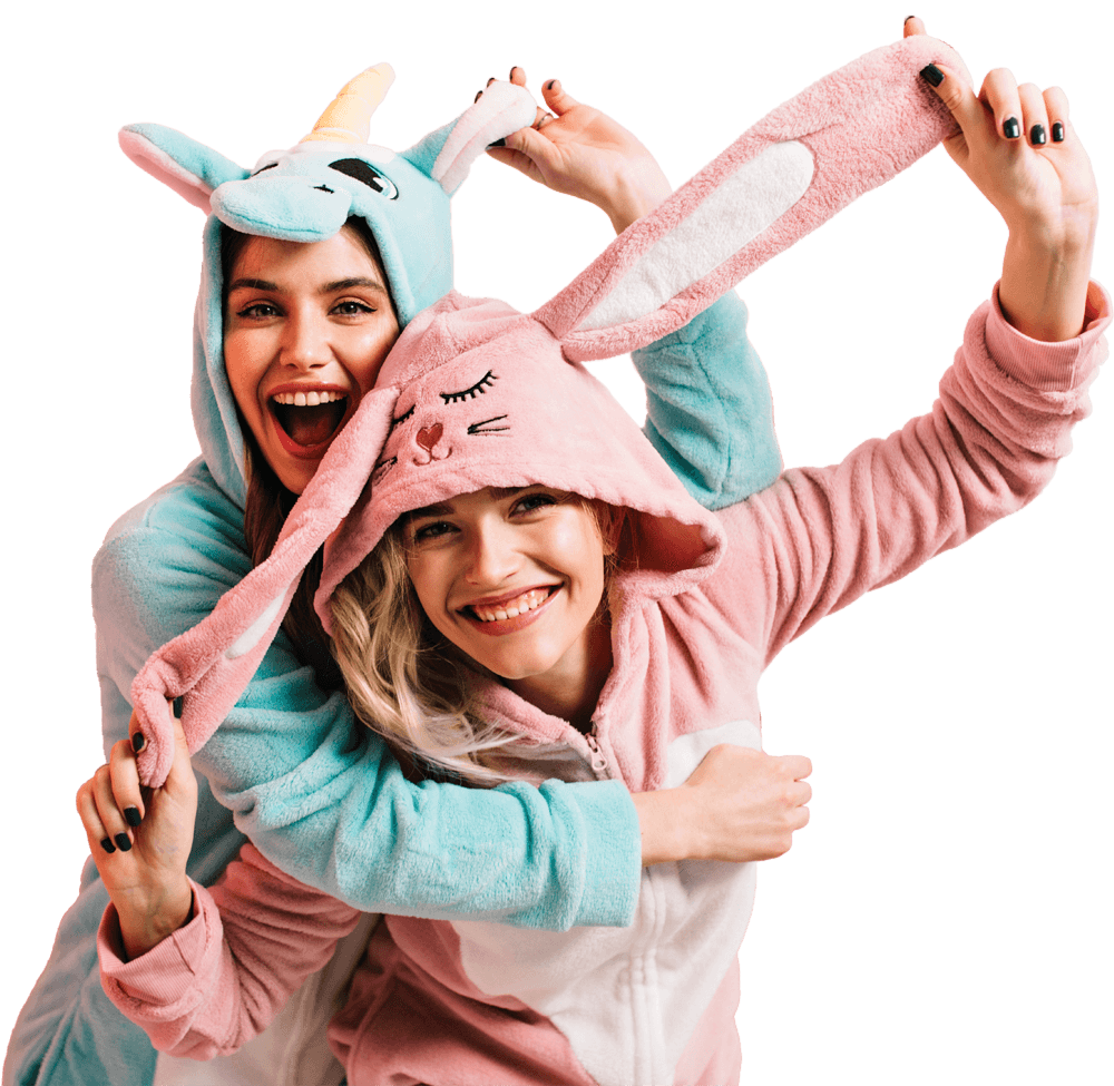 two girls wearing animal pajamas